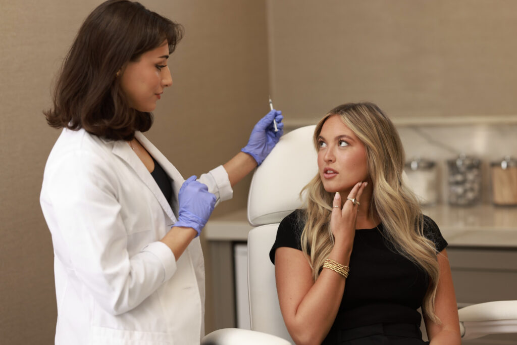 A Look Lab provider consults with a lovely female patient about Radiesse placement as her choice for the best filler in Arcadia.